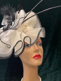 Ready to ship today from TN, USA! I ship quickly and package safely in boxes. Follow this link for more beautiful choices at my Etsy Studio https://www.etsy.com/shop/equineelan      This lightweight and gorgeous ivory white fascinator hat has distinctive black trim, black feather rhinestone clip and two long black quills for a Stunning and Original Look!  Classic but Couture! A true Kentucky Derby Original.       Hat attaches with elastic and or alligator clips. Elastic goes behind your ears and Elegant White Hat For Gift, Elegant White Costume Hat As Gift, White Mini Hats For Royal Ascot, White Fascinator For Kentucky Derby Gift, Elegant Cream Headpiece For Gift, Elegant White Costume Hats And Headpieces For Evening, Elegant White Evening Costume Hats And Headpieces, Elegant White Party Costume Hats And Headpieces, Elegant White Costume Hats For Party