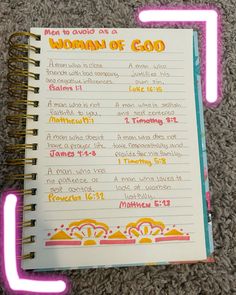 a notebook with the words woman of god written on it and neon pink writing underneath