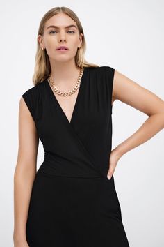 Our Davis Jumpsuit is effortlessly chic from head to toe. Her sleeveless top features slightly dropped shoulders and dips into an overlapped v-neckline, while her flowy wide-leg pants offer everybody's favorite utilitarian detail: pockets. From ultra-soft European jersey, Davis is a sleek fit that takes you from morning subway commutes to drinks after hours in style.[SPLIT] Maritza is 5'9" (177 cm) tall, wearing size XS. Approximately 56.5" (144 cm), measured from the shoulder to the bottom hem. Sustainable European Jersey (96% Tencel, 4% Elastane). Machine wash on delicate cycle, or hand wash in cold water. Tumble dry on low heat, or for best results, lay flat to dry. Designed in NYC. Handcrafted in Europe. Our production team enjoys a living wage, a 40-hour work week with paid overtime, Elegant V-neck Elastane Jumpsuits And Rompers, Versatile Fitted V-neck Jumpsuits And Rompers, Versatile Fitted V-neck Jumpsuit, Sleeveless Elastane Bodysuit For Evening, Sleeveless Bodysuit For Evening, Chic V-neck Elastane Jumpsuits And Rompers, V-neck Elastane Jumpsuit For Work, Stretch Elastane V-neck Jumpsuits And Rompers, Elegant V-neck Elastane Jumpsuit Or Romper