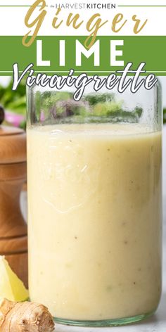 a glass jar filled with liquid next to sliced ginger