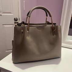 Unused Aldo Bag Owned For A Couple Months Yet Never Used ~Gold Handles And Zipper With Zero Scratches~ ~Removable And Adjustable Crossbody Strap~ ~Many Pockets And Very Spacious~ ~Willing To Negotiate :)~ Modern Taupe Bags, Everyday Taupe Satchel With Top Carry Handle, Everyday Taupe Satchel With Top Handle, Everyday Taupe Satchel With Handles, Everyday Taupe Top Handle Satchel, Shopping Satchel With Gold-tone Hardware And Double Handle, Taupe Satchel With Adjustable Strap And Double Handle, Taupe Rectangular Satchel With Gold-tone Hardware, Taupe Satchel With Removable Pouch For Everyday