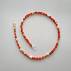 < Lasso coral and mother of pearl necklace > Like 99% of the coral on the market these days, this coral has been dyed. I use bamboo coral which is not endangered or threatened in any way, unlike natural pink or red coral (the production of which is forbidden almost everywhere in the world). Bamboo coral doesn't mean it's not organic. Every bead of it has a distinctive and beautiful coral pattern. My jewelry dyed with high quality paint. It's safe for your health and the paint does not fade Orange Red Coral Beaded Necklaces Hand-strung, Spiritual Orange Necklace Made Of Red Coral, Spiritual Orange Red Coral Necklace, Orange Gemstone Beads Necklace In Red Coral, Orange Red Coral Necklace With Colorful Beads, Orange Necklace With Colorful Beads And Red Coral, Adjustable Coral Necklace With Gemstone Beads, Adjustable Coral Necklaces With Gemstone Beads, Orange Red Coral Beaded Necklace For Gift