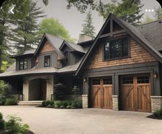 a large house with two garages on the front and one above it's doors