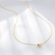 A gleaming heart of 18-karat gold anchors this chain necklace that makes a meaningful gift for a loved one. Hand-crafted using 18K gold plated sterling silver. - Care Instructions: Avoid contact with water, lotion, and perfume. Clean gently with a polishing cloth. Product Specifications: - 18K gold plating over .925 Sterling Silver - Hypoallergenic - Cubic Zirconia crystals Gold Heart Necklace In Sterling Silver, Sterling Silver Heart Necklace With Delicate Yellow Gold Chain, Delicate Sterling Silver Heart Necklace In Yellow Gold, Yellow Gold Heart Necklace With Delicate Sterling Silver Chain, Everyday Gold Heart Pendant Necklace, Gold Sterling Silver Chain Necklace With Heart Pendant, Gold Sterling Silver Open Heart Charm Necklace, Gold Open Heart Necklace With Delicate Chain, Gold Heart Necklace With Cable Chain