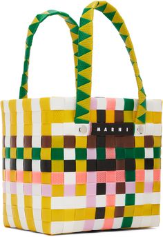 Basket-woven plastic tote in multicolor. · Fixed carry handles · Leather logo patch at face · Rivets at face and back face · Unlined · H5.5 x W5.75 x D3.5 · Total height: H9.75 Supplier color: Multicolor Multicolor Plastic Bags For Daily Use, Multicolor Travel Bag With Logo, Multicolor Plastic Travel Bag, Basket Woven, Basket Tote, Leather Logo, Rivets, Patch Logo, Kids Shop