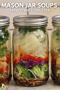 mason jar soups with vegetables and noodles in them