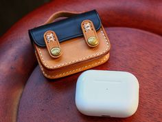 a leather case sitting on top of a wooden table