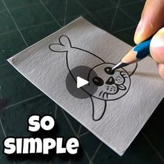 someone is drawing a dog on a piece of paper