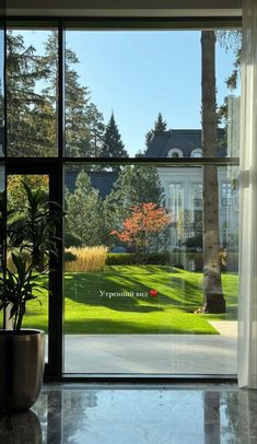 an open window with the words you are beautiful on it and a potted plant next to it