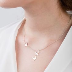 Introducing our stunning handmade sterling silver necklace featuring three flying swallows, a beautiful and unique piece of jewellery made with care in the UK. This necklace is perfect for adding a touch of elegance to any outfit and is sure to become a timeless addition to your jewellery collection. Crafted from the finest quality sterling silver, this necklace features three intricate and stylish flying swallows, symbolizing love, loyalty, and freedom. Each bird is beautifully detailed, captur Elegant Sterling Silver Necklace With Bird Design, Swallow Birds, Swallow Necklace, Handmade Silver Jewellery, Swallows, Bird Jewelry, Jewellery Design, Silver Pieces, Keep Jewelry