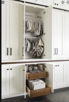 an open cabinet with files and folders on the bottom shelf in front of it