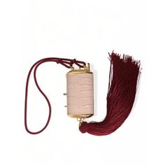 Pink Exotic Leather Mini Mirror Tassel Makeup Bag. 100% Exotic Leather. Neck Strap For Easy Carrying. Gold Metal Detailing. Clasp Closure. Gold Inner Lining. Logo Details Logo Engraved Metal Hardware. Made In Italy. High Craftsmanship. Measurements: 8cm X 5cm X 3cm. Strap: 55cm X 1cm. Material: 100% Exotic Leather. Elegant Fringe Clutch For Formal Occasions, Elegant Fringe Clutch For Formal Events, Elegant Formal Evening Bag With Tassels, Formal Clutch Evening Bag With Tassels, Elegant Beige Bags With Tassels, Luxury Formal Clutch With Tassels, Luxury Pouch Clutch With Chain Strap, Purple Gold Buckle Tassel Purse, Dolce And Gabbana Sicily Bag Mini