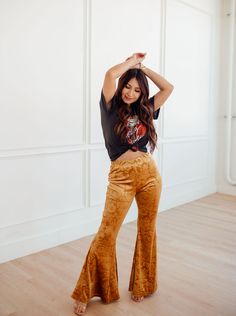 Add a chic twist to your wardrobe with the Golden Babe High Rise Velvet Flares Pants! A high banded waist tops these luxe stretch velvet pants with embossed pattern &, flared legs in a gold yellow. Pull on feature. Pair with a denim jacket and statement boots for a perfectly boho western look! Unlined. Color: Golden Yellow 30" Inseam 95% Polyester, 5% Spandex. Hand Wash Cold Wash Separately. Do Not Bleach. Lay Flat To Dry. Do Not Iron. Do Not Dry Clean. Velvet flare pants Velour flare pants Flar Statement Boots, Velvet Flare Pants, Velvet Flares, Western Look, Velvet Pants, Stretch Velvet, Pink Velvet, Gold Yellow, Pants Outfit