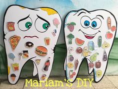 two tooth shaped magnets with different foods on them