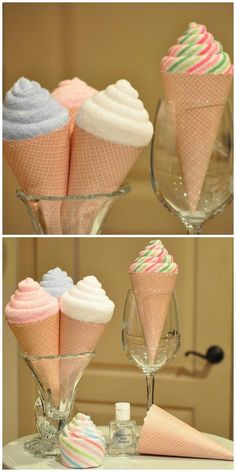 there are three ice cream cones in the glass vases and one is filled with candy