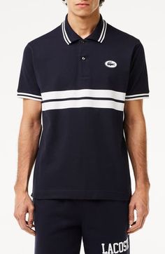 Sporty and French-inspired, this classic-fit polo features placed stripes, tipped edges and a silicone logo at the chest for iconic Lacoste style. 28" length Button half placket Spread collar Short sleeves 100% cotton Hand wash, line dry Imported French Inspired, Short Sleeves, Stripes, Nordstrom, Mens Tops, ? Logo