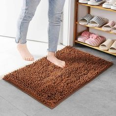 a person standing on top of a brown rug in front of a closet filled with shoes