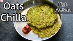 there is a metal plate with food on it and the words oats chilla