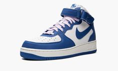 The Women’s Nike Air Force 1 Mid “Military Blue” is a women’s-only colorway of the lifestyle shoe with a sporty two-tone design.  The “Military Blue” dons a white leather base with contrasting Military Blue leather overlays and Swoosh branding.  The blue hue also appears on the adjustable ankle strap, and on the “Nike Air Force 1” detailing found on the tongue tag.  Nike switches up the look of the design with soft lavender-colored laces.  Finishing touches include a white midsole with tonal “Ai Womens Air Force 1, Nike Air Force 1 Mid, Air Force 1 Mid, Soft Lavender, Nike Air Shoes, Stadium Goods, Nike Womens, Blue Sneakers, Blue Nike