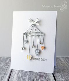 a card with hearts and stars hanging from it