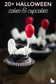 some cupcakes with red and white decorations on them