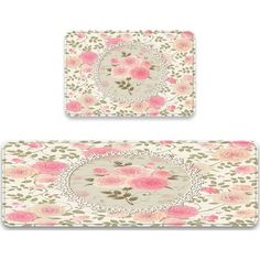 two place mats with pink roses on them