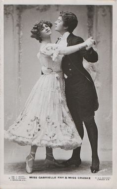 an old photo of a man and woman dancing