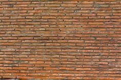 an old brick wall is shown in this image