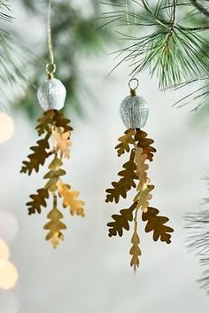 three ornaments hanging from a christmas tree