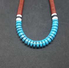 Heishi shell Multi Stone: Turquoise,Red Sandstone, Black Onyx, White Buffalo Turquoise sterling silver necklace Handmade in USA Southwestern Blue Necklace With Inlay, Blue Necklace With Round Inlay, Southwestern Blue Inlay Necklace, Southwestern Style Blue Inlay Necklace, Southwestern Blue Turquoise Inlay Necklace, Red Sandstone, White Buffalo Turquoise, White Buffalo, Multi Stone