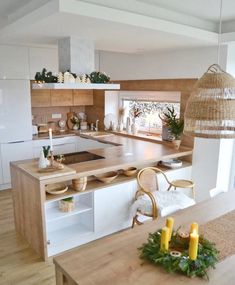 the kitchen is clean and ready to be used for cooking or dining, with candles on the counter