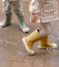 Perfect for rainy day adventures, these Toddler Rain Boots are designed in waterproof rubber. Discover thoughtful details like the extended twill finger loop for easy on-and-offs and the embossed heel. With slip resistant soles, the Rain Boot comes in three colors to ‘Pehr’ with the Park Jacket, the perfect Rainwear for the coming season. Cute Rain Boots, Toddler Rain Boots, Toddler Wearing, Honey Yellow, Rain Boot, Buy Buy Baby, Rainy Day Outfit, Mini Boden, Rain Wear