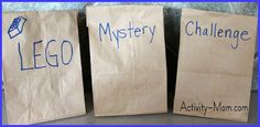 three brown paper bags with writing on them that say lego and mystery challenge written on them