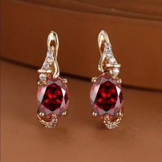 Brand New Women's Hanging Ruby & Diamond Earrings 14k Gold Plated Sterling Silver 2ct Natural Red Ruby Gemstones Genuine 1ct Lab Created Radiant Cut Diamonds Measurements .6" Tall X .4" Wide Retail Price $300 Buy With Confidence From A Trusted Seller W/ A 99%+ Feedback Rating! A0239 (Id-1002-) Ruby Diamond Earrings, Radiant Cut Diamond, Radiant Cut, Ruby Diamond, Ruby Gemstone, Red Ruby, Natural Red, Gold Plated Sterling Silver, Earrings Jewelry