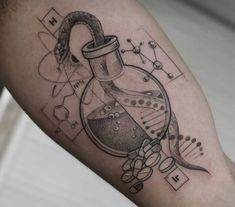 a man's arm with a science tattoo on it