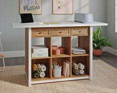 an office desk with drawers and shelves on the top, in front of a window