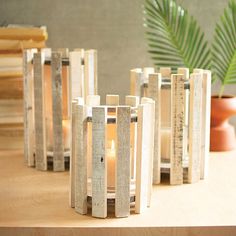 a group of candles sitting on top of a wooden table