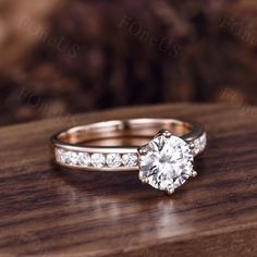 a diamond ring on top of a wooden table