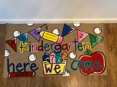 a door mat that has been decorated with words and an apple for the school year