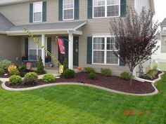 a house with landscaping in front of it