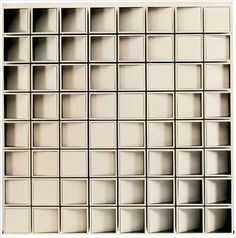 an abstract white background with lots of squares and rectangles in the shape of cubes