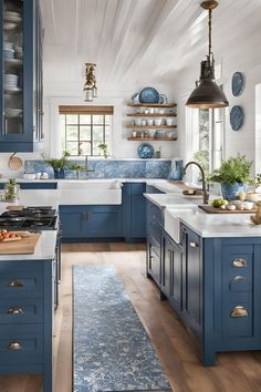 a kitchen with blue cabinets and white counter tops