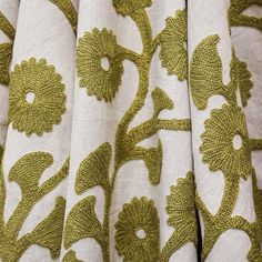 closeup of green and white fabric with flowers on it