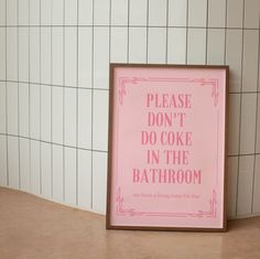 a pink sign that says please don't do cake in the bathroom