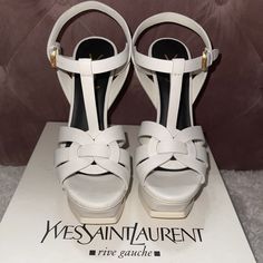 Brand New White Ysl Tribute Comes With Original Box And Dust Bag. Size 36.5 Perfect And Most Comfortable Bridal Shoe Or For A Casual Evening/Day Out. Modern White Sandals With 4-inch Heel, Luxury White Open Heel Sandals, Luxury White Open Toe Heels, Luxury White High Heel Sandals, Designer White Sandals With Heel Strap, White Block Heel Sandals With Branded Insole, Designer White Sandals With Heel Loop, Luxury White Platform Heels, Luxury White Sandals With Heel Strap