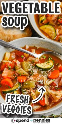 two bowls filled with vegetable soup on top of a table