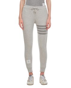 Thom Browne joggers blend comfort and style, featuring an elasticated waistband and drawstring. Ribbed cuffs provide a secure fit, while the signature 4-bar detail adds sophistication, making them ideal for casual outings or athleisure wear.

- Composition: 100% Cotton  
- Gender: Woman Grey Track Pants, Bar Detail, Joggers Track Pants, Designer Products, Athleisure Wear, Thom Browne, The List, Track Pants, Athleisure