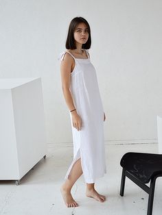 "Pure white long women's softened linen night dress with regulating straps. Choose size: XS Bust 82 - 84 cm. ( 32 1/4\" - 33\") Waist 66 - 68 cm. / (26\" - 26 3/4\") Hips 90 - 92 cm. / (35 1/2\" - 36 1/4\") S Bust 86 - 88 cm. ( 33 3/4\" - 34 3/4\") Waist 70 - 72 cm. / (27 3/4\" - 28 1/4\") Hips 94 - 96 cm. / (37\" - 37 3/4\") M Bust 90 - 92 cm. ( 35 1/2\" - 36 1/4\") Waist 74 - 76cm. / (29 1/4\" - 30\") Hips 98 - 100 cm. / (38 1/2\" - 39 1/4\") L Bust 94 - 96 cm. ( 37\" - 37 3/4\") Waist 78 - 80 White Cotton Lounge Dress, White Slip Dress With Tie Straps, White Linen Sleeveless Dress With Adjustable Straps, White Sleeveless Linen Dress With Adjustable Straps, White Dress For Spring Lounging, Summer White Linen Dress With Adjustable Straps, White Linen Dress With Adjustable Straps, White Summer Dress For Lounging, White Linen Loungewear Dress