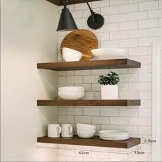 some shelves with bowls and plates on them