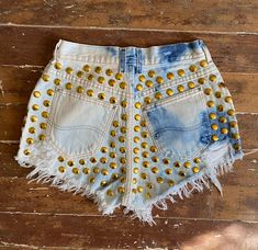 PEGGYOWASHERE™ VINTAGE custom CUT OFF DENIM FESTIVAL SHORTS 100% COTTON zipper  FLY  size 6  front pocket covered in round brass studs high waist 26 hips 39 rise front 11 rise back 16 inseam 2.25 inches Fitted Denim Shorts For Festivals, Punk Style High-waisted Jean Shorts For Summer, Punk High Waist Jean Shorts For Summer, Summer Punk High Waist Jean Shorts, High Waist Denim Festival Shorts, Punk Style Short Bottoms For Festival, Punk Style Cutoff Jean Shorts For Summer, Punk Cutoff Jean Shorts For Summer, Edgy Light Wash Bottoms For Summer